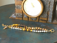 Load image into Gallery viewer, Fresh water pearl, swarovski crystal and rosegold colored beads in earth tones, triple strand bracelet.
