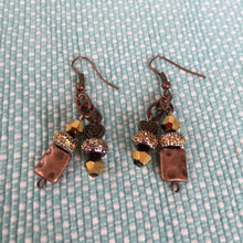 Load image into Gallery viewer, Earrings, Hand Crafted, Amber Colored Beads with Hammered Metal Square Beads, Swarovski Crystals and heart shaped metal bead W/ Celtic Knot.