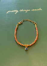 Load image into Gallery viewer, Single Strand Peach Colored Freshwater Pearl Bracelet with Sapphire Colored Crystal Charm and Paperclip Adjustable Chain
