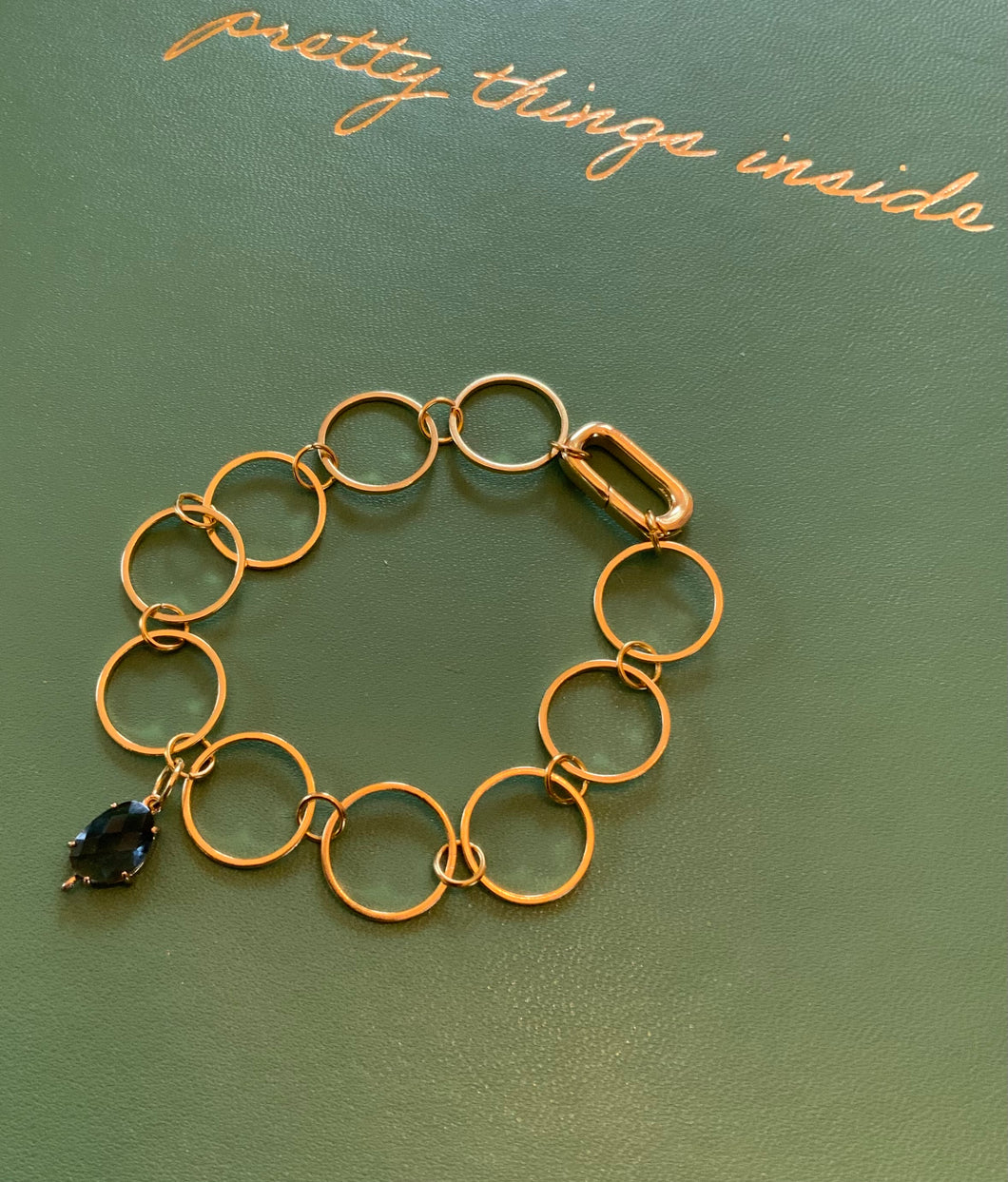 Gold Filled Circular Connected Bracelet with Sapphire Blue Crystal Charm and Lever Clasp For Adding Charms and Adjusting Length.