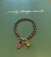 Load image into Gallery viewer, Double Strand 14Kt. Gold and Light Garnet Beads in Black Wire Wrapped chain with Ruby Colored Leaf Charm, Amethyst Swarovski Crystal and Pink Round Charms
