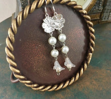 Load image into Gallery viewer, For the Bride, Vintage Style, Shimmering Creamy White Glass Pearls with Clear Lucite Lily drop and Silver Floral Charm.
