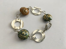 Load image into Gallery viewer, Handcrafted Handpainted Ceramic Beaded and Silvertone Disc Bracelet with Funky Flair
