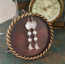 Load image into Gallery viewer, For the Bride, Vintage Style, Shimmering Creamy White Glass Pearls with Clear Lucite Lily drop and Silver Floral Charm.
