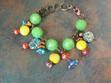 Load image into Gallery viewer, Fun N Funky, Handcrafted Bracelet with Mixed Beads of Czech Glass, Ceramic Beads and Glass Flowers  in Green, Blue, Lime &amp; Rust Colorations
