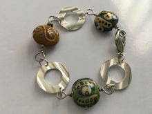 Load image into Gallery viewer, Handcrafted Handpainted Ceramic Beaded and Silvertone Disc Bracelet with Funky Flair
