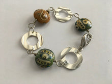 Load image into Gallery viewer, Handcrafted Handpainted Ceramic Beaded and Silvertone Disc Bracelet with Funky Flair
