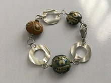 Load image into Gallery viewer, Handcrafted Handpainted Ceramic Beaded and Silvertone Disc Bracelet with Funky Flair
