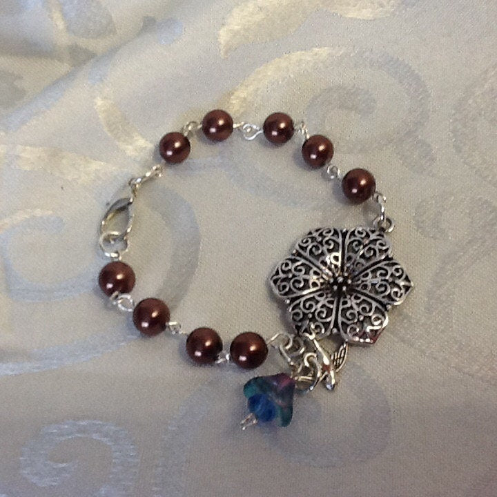 For the Bride, Vintage Style, Handcrafted Bracelet with Chocolate Glass Pearls, Silver Floral Centerpiece and Czech Glass Flower/Bird Dangle