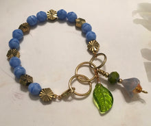 Load image into Gallery viewer, Feminine, Delicate, Handcrafted Bracelet, with Beach Blue Czech Glass, Golden Sunburst Bead, &amp; Crystal Drop
