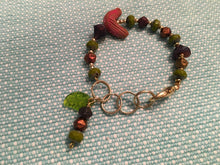 Load image into Gallery viewer, Feminine, Delicate, Handcrafted Bracelet, with Earth Tone Czech Glass, Goldtone Beads, Ceramic Bird &amp; Green Czech Glass Leaf Drop
