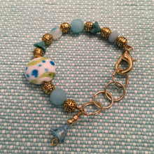 Load image into Gallery viewer, Fun N Funky, Handcrafted Bracelet with Mixed Beads of Czech Glass, Ceramic Beads, and drop Petal in Baby Blue Colorations
