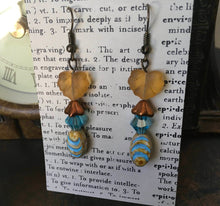 Load image into Gallery viewer, Czech Glass, Boho,Hand Crafted, Earrings in Blue/Cream Ceramic Beads with Copper Colored Glass Flowers and Frosted Amber Colored Leaves
