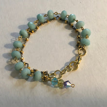 Load image into Gallery viewer, Delicate and feminine, double layered, robin’s egg blue beaded chain &amp; 18K gold beaded chain, w/ aqua colored Swarovski crystal drop
